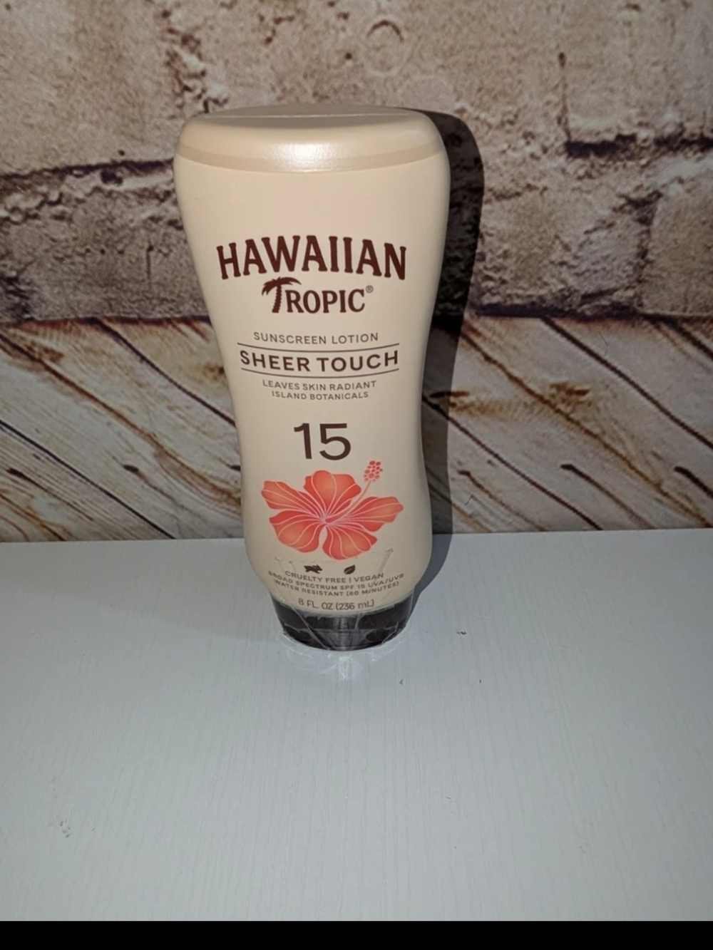 ~Hawaiian Tropic Sheer Touch Ultra Radiance sunscreen lotion with SPF 15..